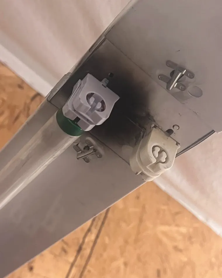 Close-up of scorched sockets on the fixture