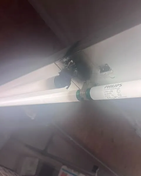 A melted T8 lamp socket at the end of a tube