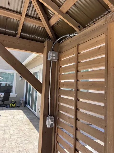 New switch and outlet boxes on a pergola post