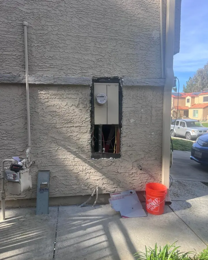 The wall opened up where the old panel came out